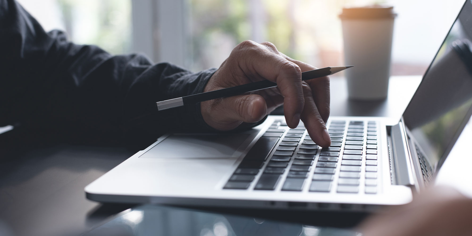 man typing on a computer